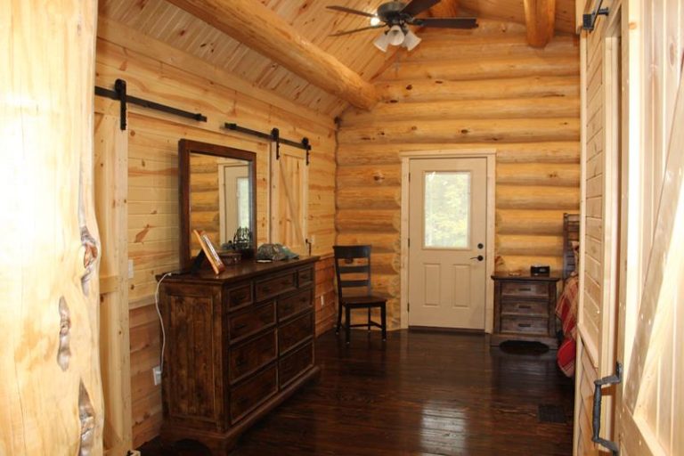 Barn door and entry hall with dark hardwood floors