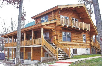 Exterior stair between two levels of porch