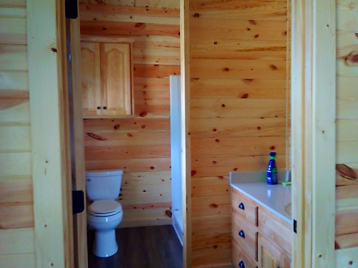 Interior hall and bath with pine paneling
