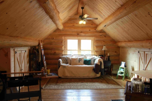 Loft sitting area under the vaulted pine ceiling