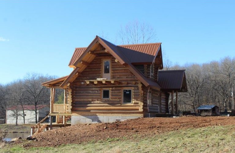 Gable end of the Schaaf across the winter woods