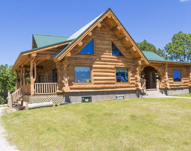 The Troyer sited on open lawn with deep porches