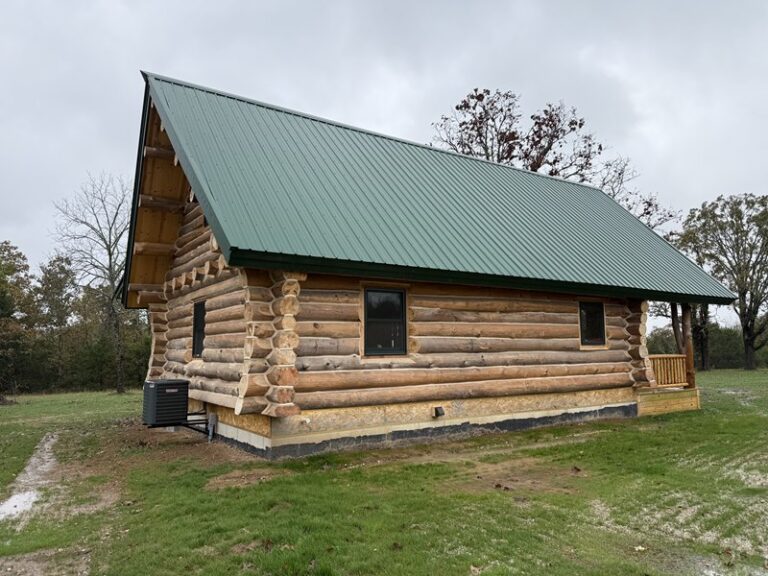 Full-length porch along the Rogers under a green metal roof