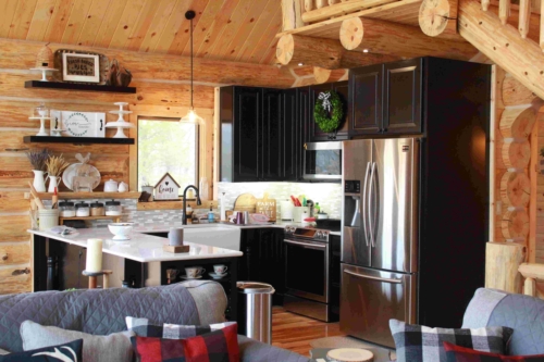 Pearce kitchen with dark cabinetry and stainless appliances