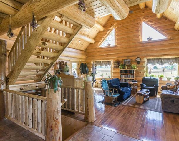Hand-peeled log staircase in the great room