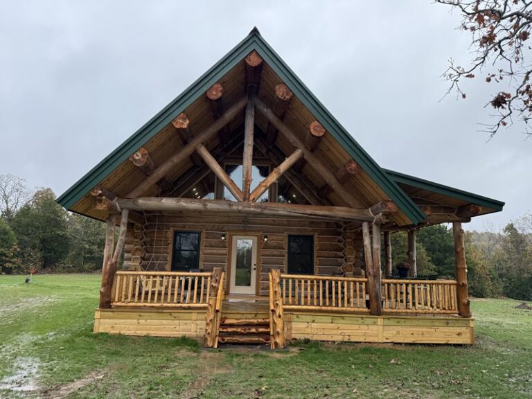 Log truss and gable detail over an entry porch