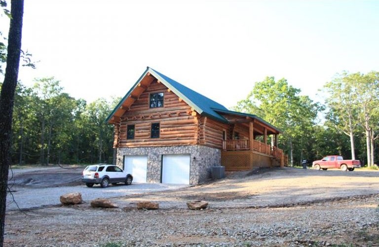 The Pearce with attached garage wing at dusk