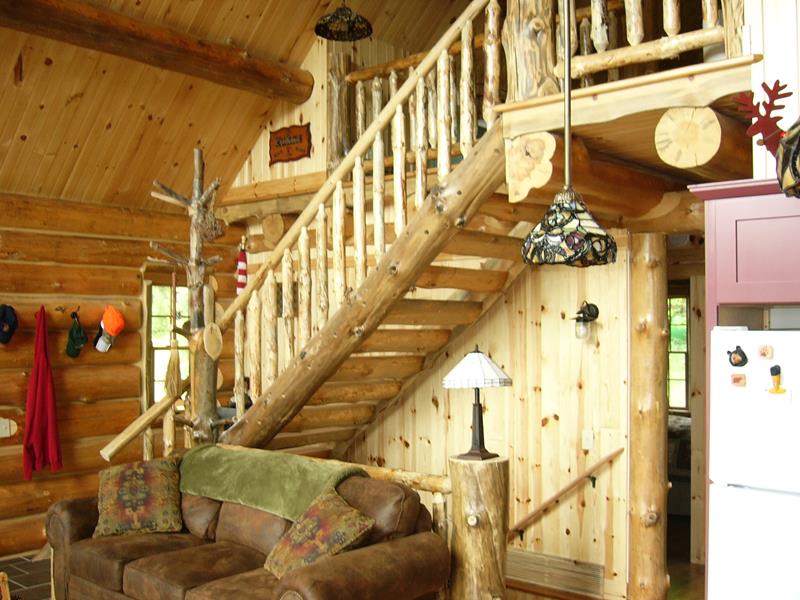 Log staircase rising to the Crystal loft