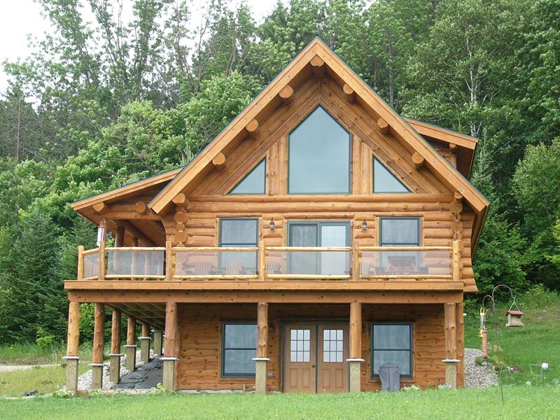 The Crystal log home with its gable window wall and full-width deck